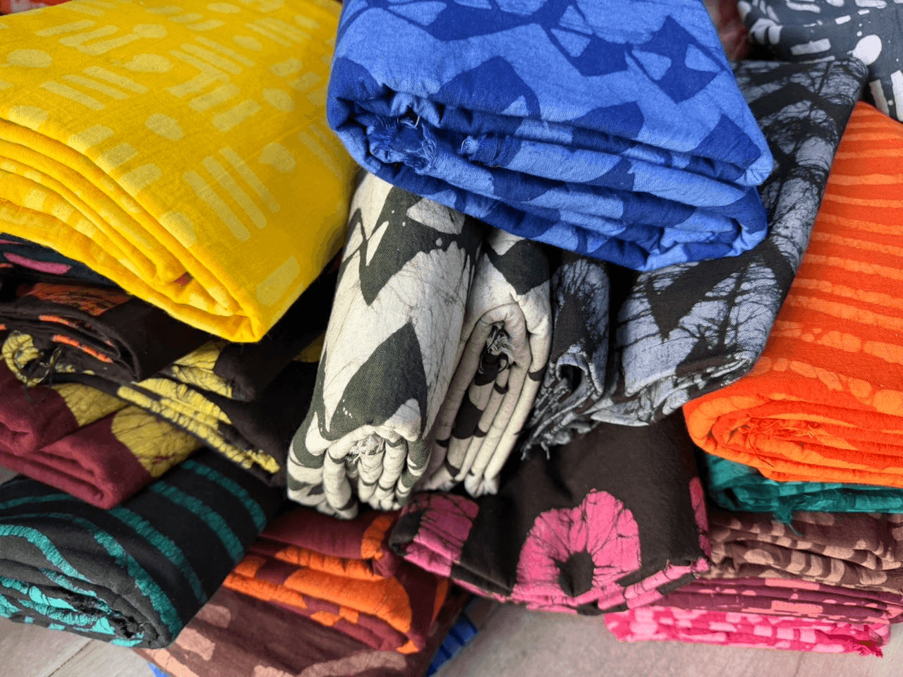 Hands at work: stitching and weaving natural fabric
